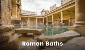 A stone-built pool built in the Roman times in Bath is surrounded by a colonnade. The water is blue-green, and a small channel carries water into the pool.