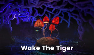 Psychedelic glowing mushrooms with undulating stems sit atop a mound. There are winding, tangled shapes on the ceiling that look like roots. Glowing lines on the floor radiate outwards from the mushrooms. Everything is large in scale and looks like a wonderland.